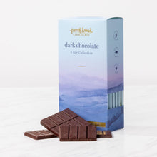 Load image into Gallery viewer, Dark Chocolate 6 Bar Collection box with watercolor mountains and stacked dark chocolate pieces on marble.
