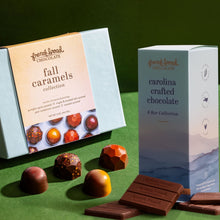 Load image into Gallery viewer, Fall in Asheville Gift Set: Fall Caramels box and Carolina Crafted 6 Bar Collection with bonbons and bars on a green surface.
